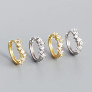 Set of four S925 silver wave huggie earrings with sparkling crystals in gold and silver