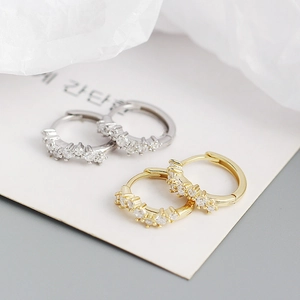 Chic S925 silver wave huggie earrings with sparkling crystals in gold and silver finish