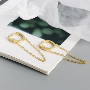 Detailed close-up of 18K gold-plated S925 silver hoop earrings with zircon and tassel chains
