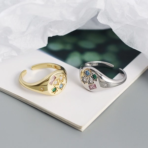 Macro detail of S925 sterling silver rings with colorful zircon star inlays