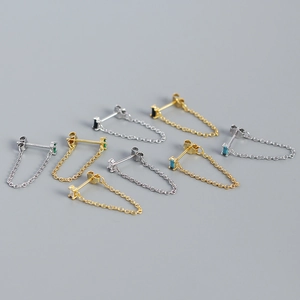 Macro detail of S925 silver tassel chain earrings with colorful zircon gemstones