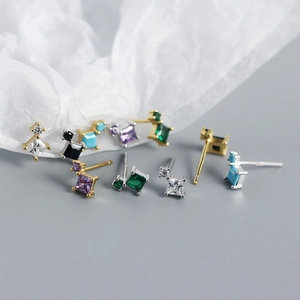 Detail of S925 silver studs featuring colorful geometric cubic zirconia stones
