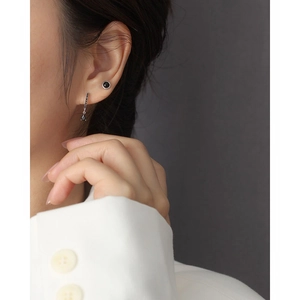 Close-up of S925 silver stud earrings with black agate and elegant long drop pendant
