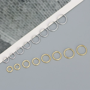 Detailed view of gold and silver S925 sterling silver hoop rings in various sizes