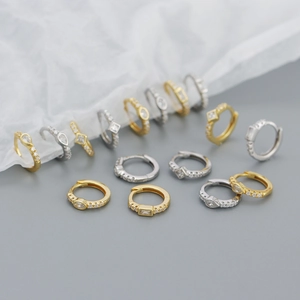 Detailed close-up of S925 silver hoop earrings with sparkling cubic zirconia inlay