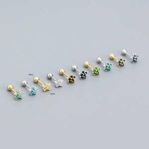 Macro detail of 3mm zircon flower studs with s925 silver screw back in various colors