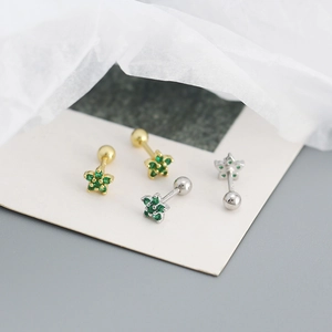 Close-up of S925 silver flower stud earrings with green zircon and screw ball backings