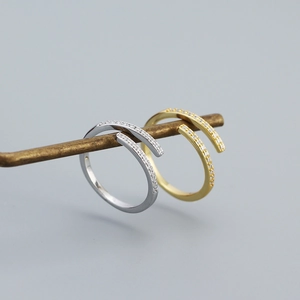 Detailed close-up of double-layer geometric S925 silver rings with pavé zircon settings