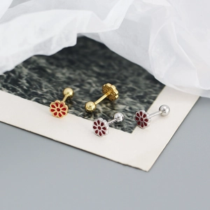 Macro detail of S925 silver stamp on floral earrings with red enamel and screw back