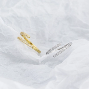 Macro view of minimalist S925 silver open rings with micro-pave cubic zirconia inlay