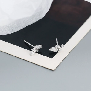 Detailed view of silver s925 leaf stud earrings set with sparkling marquise zircons