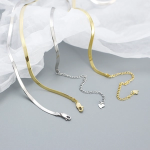 Detail of S925 sterling silver flat snake chain necklaces with lobster clasp and heart pendant