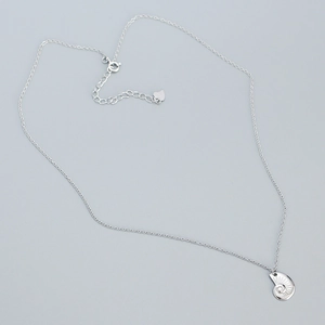 Detailed close-up of S925 sterling silver nautical shell pendant with fine radial textures