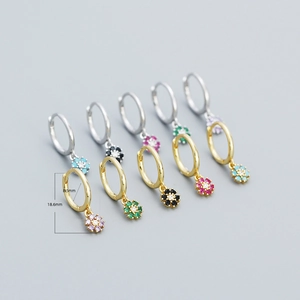 Detail of s925 silver flower hoop earrings with colorful zircon stones in five vibrant shades