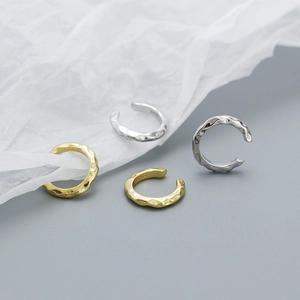 Close-up of S925 sterling silver stamp on irregular hammered texture ear cuffs