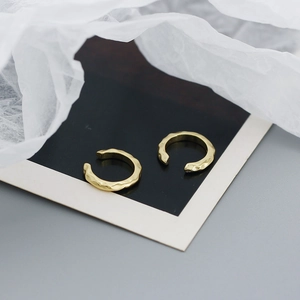 Detail view of irregular hammered texture on S925 sterling silver gold ear cuffs
