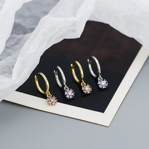 Detailed macro view of S925 silver flower hoop earrings with purple zircon stones