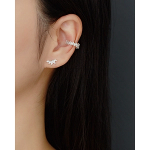 Close-up of S925 silver ear cuff and marquise zircon leaf stud earring on a model