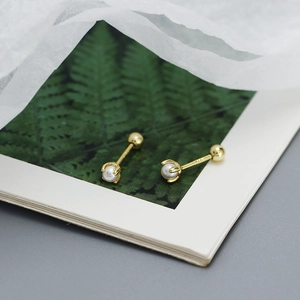 Macro view of S925 silver gold-plated pearl screw stud earring with S925 hallmark