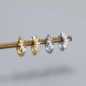Detailed macro view of S925 sterling silver hoop earrings with marquise cubic zirconia