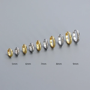 Detail of S925 sterling silver hoop earrings in sizes 5mm to 9mm with silver and gold finish