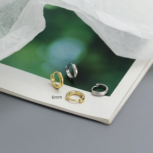 Close-up of minimalist S925 sterling silver hoop earrings with 6mm diameter mark