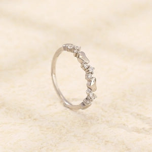 Polished S925 sterling silver heart ring featuring delicate cubic zirconia pavé setting