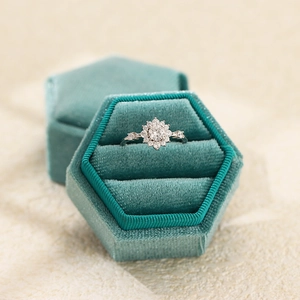 Luxurious S925 silver flower halo engagement ring with round zircon in a teal velvet box