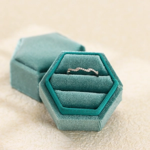 Detailed view of S925 sterling silver wavy ring with micro-pave cubic zirconia inlay