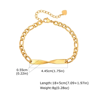 Detail of gold Figaro chain bracelet with twisted rectangular plate and heart charm
