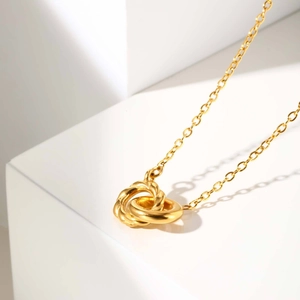 Minimalist gold stainless steel necklace with interlocking twisted and smooth rings