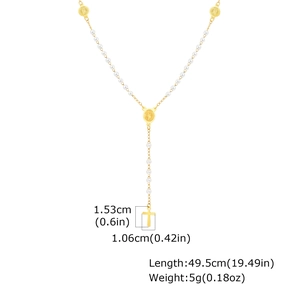 Dettaglio della collana di perline dorate con croce, lunghezza 49,5 cm e peso di 5 g