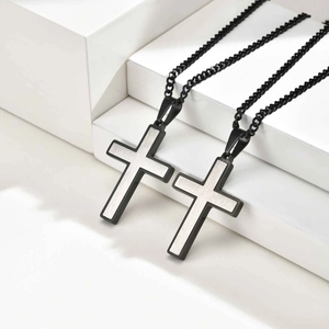 Minimalist two-tone stainless steel cross pendant with brushed finish and black chain