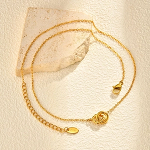 Detail view of gold linked circles necklace with K18 engraving on adjustable chain
