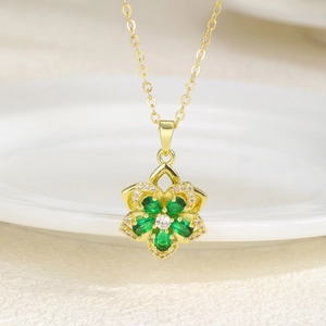 Elegant rotating flower necklace with green zircon petals and gold plated chain pendant