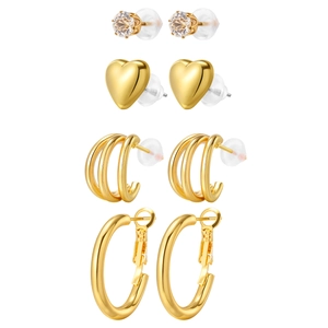 Goldenes Ohrring-Set mit Kristallsteckern, Herzsteckern, Lagen-Creolen und großen Ringen