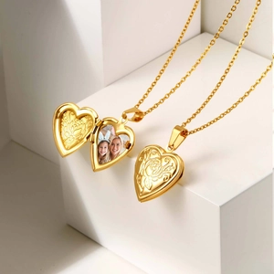 Golden heart locket necklace with rose relief, showing both open and closed positions