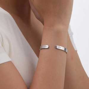 Women's minimalist stainless steel open bangle with cross charms and zircon stones