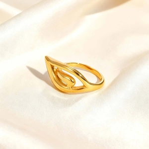 Chic 18K gold-plated stainless steel hollow wing ring with teardrop detail on silk
