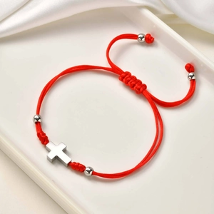 Adjustable red braided rope bracelet with a silver stainless steel cross pendant