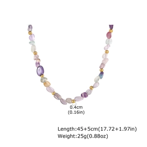 Detailed view of natural stone beads and gold metal spacers on a vintage chain necklace