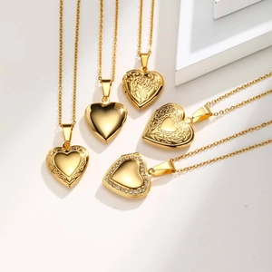 Golden heart locket necklace collection featuring engraved patterns and crystal borders