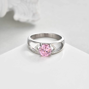 Stainless steel ring with pink zircon centerpiece and geometric cutout design