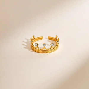 Macro shot of 18K gold plated crown ring featuring five sparkling zircon gemstones