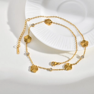 Golden stainless steel necklace featuring five textured flower charms and zircon stones