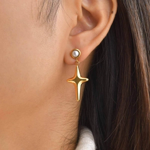 18K gold plated stainless steel star drop earrings with pearl stud on female model