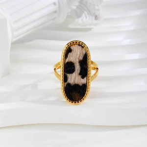 Macro view of golden leopard print ring with oval pony hair inlay and beaded edge