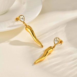 Detailed close-up of gold waterdrop zircon earrings with elegant corniced horn pendants
