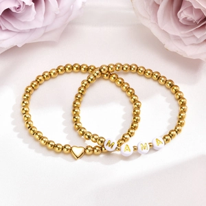Golden bead bracelet set with heart pendant and MAMA letter beads on white silk