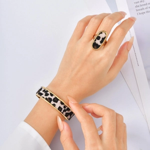 Golden leopard print jewelry set with oval ring and open cuff bracelet for women